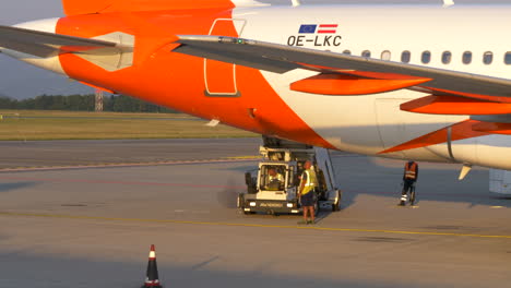 Ground-Crews-Moving-Stair-Truck-On-An-Airplane-At-Bergamo-Airport-In-Italy