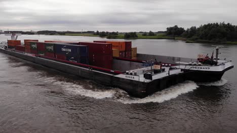 Aerial-View-Of-Pair-Of-Cargo-Container-Ships-Travelling-Along-River-Oude-Maas