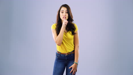 an-attractive-young-woman-standing-with-her-finger