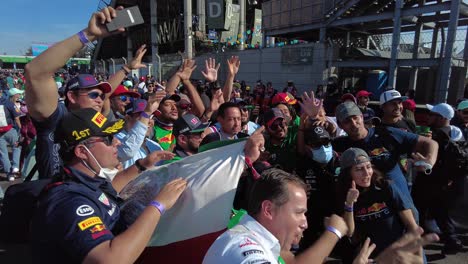 Group-of-Mexican-fans-spectators-celebrating-cheering-the-podium-of-Sergio-Checo-Perez-at-the-F1-GP-Grand-Prix-in-Mexico-City