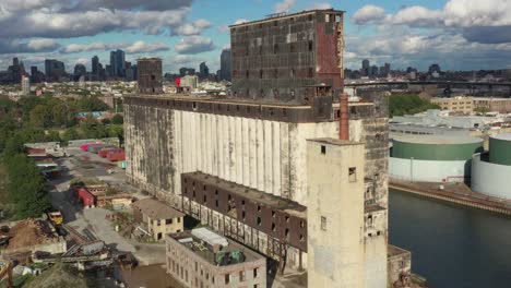 Aerial-rise-near-massive-abandoned-grain-terminal-in-Brooklyn-New-York-City