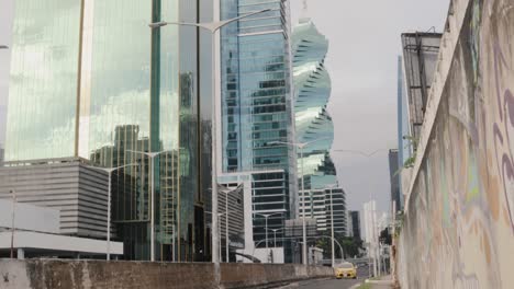 Tilt-shot-revealing-3-of-Panama’s-most-spectacular-architectural-design-masterpieces,-ultra-modern-commercial-urban-city-developments,-Panama-City