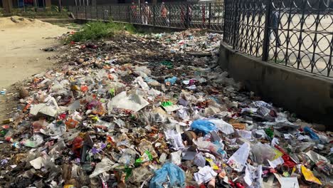 Plastic-trash-beside-a-railway-station,-environment-pollution