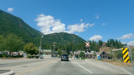 POV,-Vehicles-Driving-In-Street-Of-Pemberton-Village-In-British-Columbia,-Canada