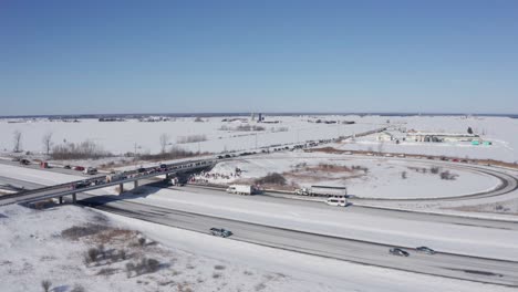 Aerial-rotating-view-shows-massive-support-for-freedom-convoy-in-rural-canada-on-hwy-417-and-138