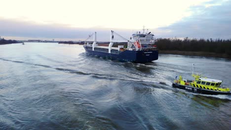 River-Police-Boat-Going-Past-Onego-Mississippi-Cargo-Ship-On-Oude-Maas
