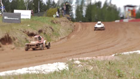 Car-buggy-competition-on-a-gravel-track,-fighting-for-the-first-place-by-participating-in-the-competition
