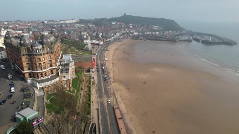 Scarborough-Castle-And-Grand-Hotel-South-Bay,-Yorkshire,-United-Kingdom---aerial-drone-shot