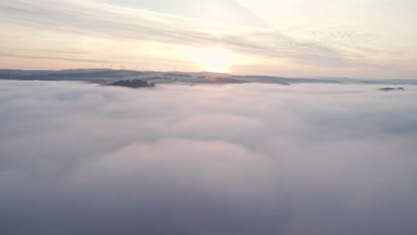 A-stunning-sunrise-over-the-vast-valleys-of-west-Germany-that-are-filled-with-obscure-morning-mist