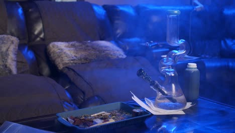 Bong-and-weed-on-table-with-smore-in-the-livingroom