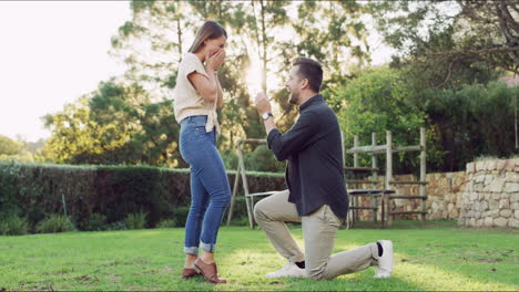 a-happy-young-couple-getting-engaged-in-the-park
