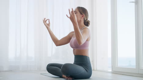 a-young-woman-meditating-at-home