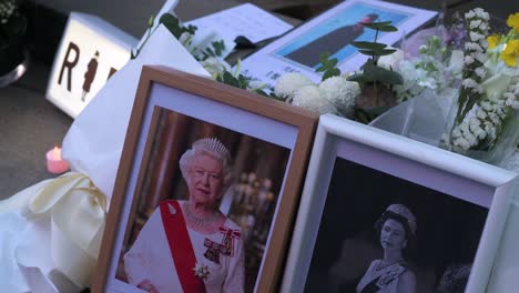 Framed-photos-of-Queen-Elizabeth-II-next-to-flower-bouquets-are-seen-outside-the-British-Consulate-General-as-a-tribute-after-the-passing-of-the-longest-serving-monarch-Queen-Elizabeth-II