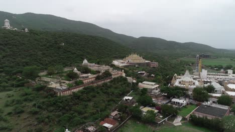 Aerial-shot-of-forest-mountain-and-temples-on-the-top-of-the-mountain