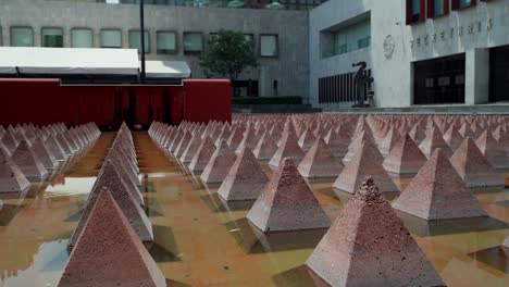 Low-Angle-View-Of-Small-Stone-Pyramids-At-Entrance-To-The-Museum-of-Tolerance-and-Memory-In-Mexico-City