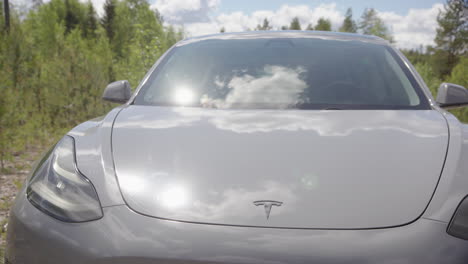 SLIDER-shot-of-a-2020-Tesla-Model-3-electric-vehicle,-EV,-sunny,-in-nature