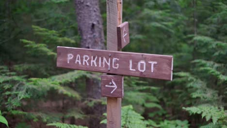 A-parking-lot-sign-along-a-path-in-the-woods