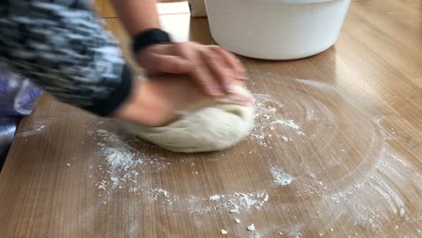 The-woman-kneads-the-dough