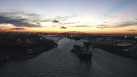 Beautiful-sunset-backdrop-of-Corpus-Christi-bridge-and-barge-boat