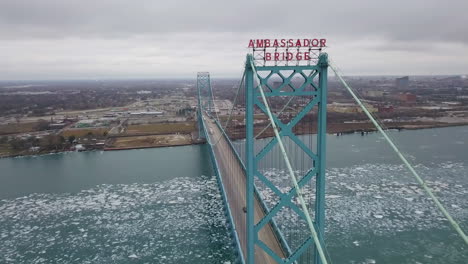 The-waterfront-of-Detroit,-Michigan-in-winter-with-the-Ambassador-Bridge-in-the-foreground