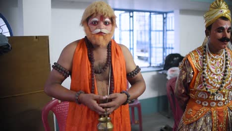 Indian-Actors-and-artists-getting-dressed-up-as-various-roles-or-characters-for-Stage-performance-at-a-drama,-in-a-Fair-and-Festival-in-Kolkata,-India