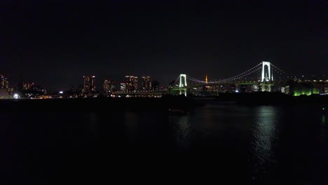 Rising-on-rainbow-bridge-at-night-time-over-water