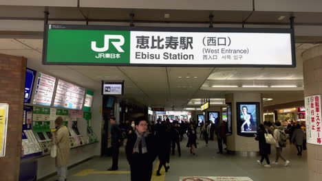 People-walking-inside-West-entrance-exit-of-Ebisu-Station