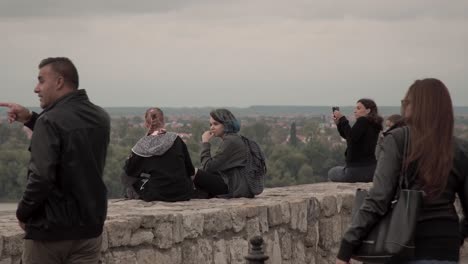Tourists-on-a-balcony-overlooking-Belgrade,-Serbia