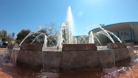 SLOW-MOTION-Water-fountain-outside-Rabobank-Arena,-Bakersfield,-California