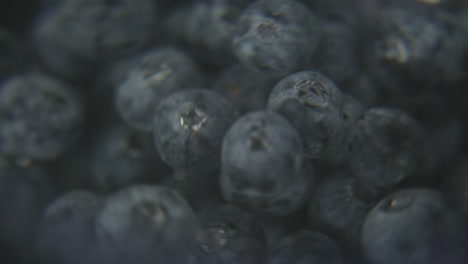 macro-spinning-blueberries-under-water-with-black-background