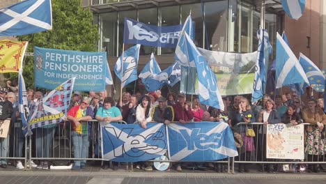 Slow-motion-close-up-of-Scottish-protesters-and-their-flags-outside-the-Perth-Concert-Hall-where-the-Tory-Leadership-Hustings-is-being-held
