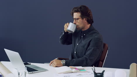 a-handsome-young-male-architect-drinking-coffee