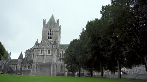 Old-Christ-church-cathedral-in-Dublin-city-on-rainy-day-with-trees-in-foreground