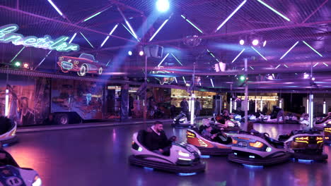 Wide-shot-of-bumper-car-attraction-on-fun-fair-with-blinking-lights,real-time