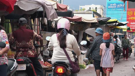People-Exploring-a-Busy-Asian-Market-in-the-Day