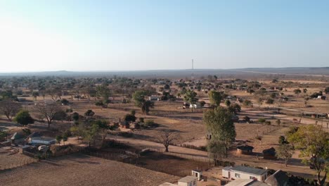 A-Rising-Drone-Shot-of-an-African-Countryside-Area-under-sunny-conditions