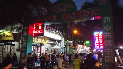 Xian,-China---August-2019-:-Crowds-visiting-the-popular-street-food-district-called-Muslim-Quarter-at-night,-Xian-town-,-Shaanxi-Province,-central-China