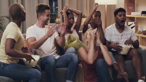 a-group-of-friends-cheering-while-watching-tv