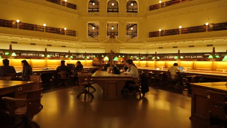 State-Library-Victoria-at-nighttime-people-studying-at-melbourne-library-Melbourne-tourism-attractions,-melbourne-library