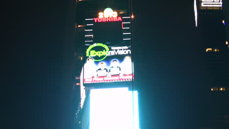 Zoom-out,-Huge-billboard-on-wall-of-modern-building-in-Manhattan-times-square-in-New-York