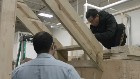 African-American-trade-school-student-learns-how-to-build-a-wooden-staircase
