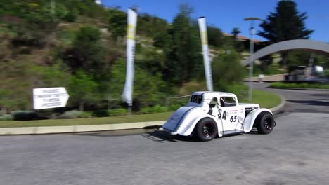 White-Classic-roadster-speeds-up-the-course-at-Simola-Hillclimb