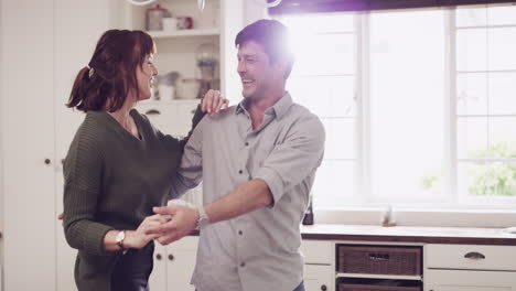 a-couple-slow-dancing-in-their-kitchen