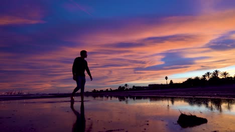 Watch-the-sunset-as-you-walk-from-side-to-side-going-through-and-feeling-the-water-on-your-bare-feet,-freedom-and-reconnection-with-nature