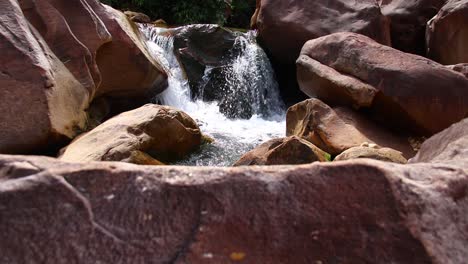 Beautiful-cascading-waters-along-massive-boulders-in-Veal-Pouch-Waterfall-in-Kampong-trach-Mountains-of-Kampot,-Cambodia