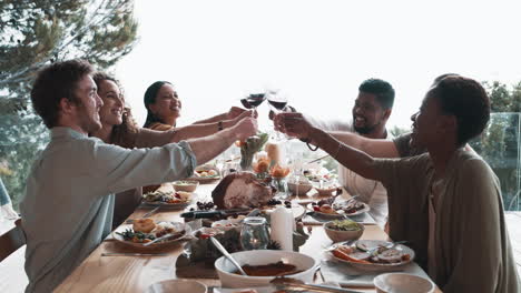 a-group-of-friends-toasting-during-a-dinner-party