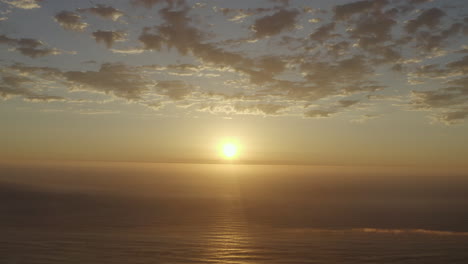 4k-drone-footage-of-the-sun-setting-over-the-ocean