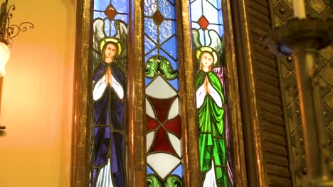 Vertical-panning-shot-of-beautiful-church's-windows