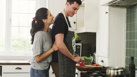 a-young-couple-preparing-a-heathy-meal-at-home