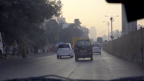 car-pov-in-the-morning-an-evening-under-construction-metro-thane-Mumbai-Maharashtra-India-empty-road-November-2020-taxi-on-road-goldern-hours